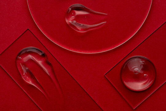 Clear cosmetic gel on a vibrant glass surface