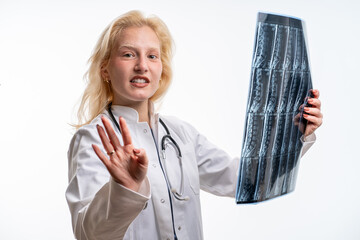 Female Doctor Explaining Spine MRI Results To Camera On White Background