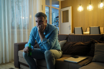 Middle-Aged Man Sitting On Couch Bored Without Purpose In Life