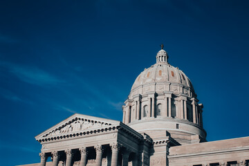 The Missouri State Capitol building in Jefferson City under a clear blue sky. © mailcaroline