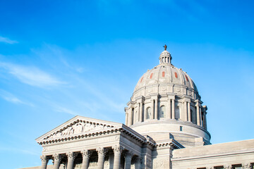 Close-up of the Missouri State Capitol building in Jefferson City under a clear blue sky.