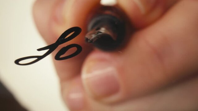 Fountain pen write letter, document sign on an antique handwritten letter. Vintage nib pen and handwritten english cursive style font copperplate, spencerian. Old history background. Retro style.