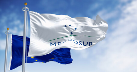 Flags of Mercosur and European Union waving in the wind on a clear day © rarrarorro