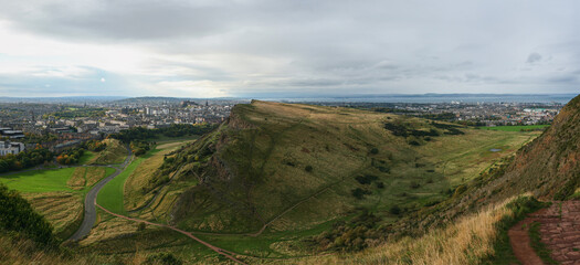 View from Arthur's Seat, Salisbury Crags and city of Edinburgh in background, North sea visible at distance
