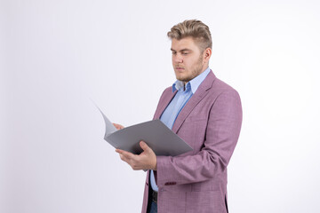 Businessman in purple jacket reading documents