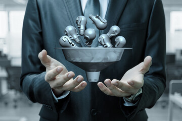 Ideas flowing through a funnel.