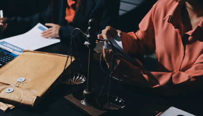 Consultation and conference of professional businesswoman and Male lawyers working and discussion having at law firm in office. Concepts of law, Judge gavel with scales of justice