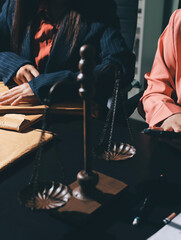 Consultation and conference of professional businesswoman and Male lawyers working and discussion having at law firm in office. Concepts of law, Judge gavel with scales of justice