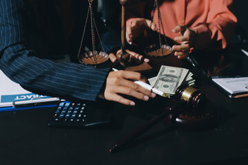 Consultation and conference of professional businesswoman and Male lawyers working and discussion having at law firm in office. Concepts of law, Judge gavel with scales of justice