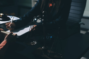 Consultation and conference of professional businesswoman and Male lawyers working and discussion having at law firm in office. Concepts of law, Judge gavel with scales of justice