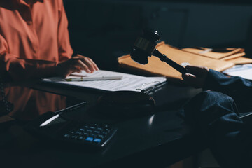 Consultation and conference of professional businesswoman and Male lawyers working and discussion having at law firm in office. Concepts of law, Judge gavel with scales of justice