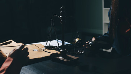 Consultation and conference of professional businesswoman and Male lawyers working and discussion having at law firm in office. Concepts of law, Judge gavel with scales of justice