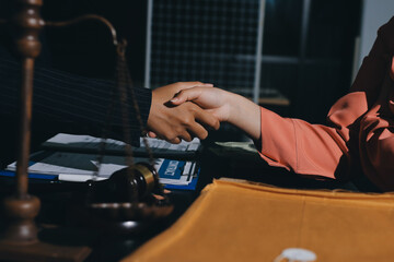 Consultation and conference of professional businesswoman and Male lawyers working and discussion having at law firm in office. Concepts of law, Judge gavel with scales of justice