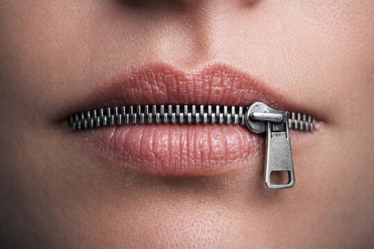 A mouth with a metal zipper fastened is a symbol of silence.