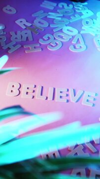 Hand creating the word believe concept