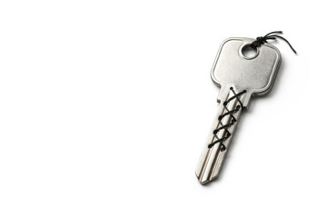 Metal key with lacing made of thread. Space for text.