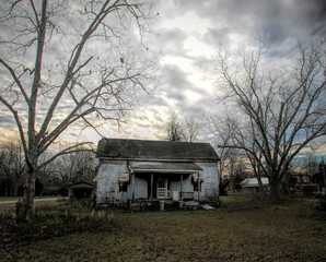 Run down shack with stormy sky