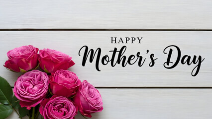 A bouquet of pink roses on a white wooden background with a happy mothers day greeting card