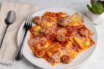 spinach and mushroom ravioli top with chicken sausage