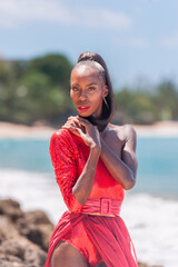 Portrait of Beautiful Caribbean Adult Teen in Barbados. Wearing Red Bikini on a tropical beach. 
