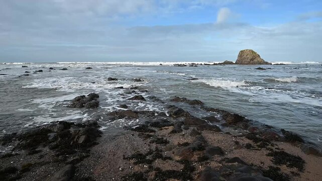 Winter high tide at Black Rock at Widemouth Bay beach South West England  UK