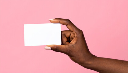 A person's hand is holding an empty blank business card or paper sign to show a message for communication and advertisement with space for a greeting note in this isolated presentation