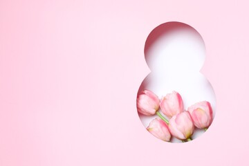 Festive 8 March greeting card design with pink tulip flowers, top view. Happy International Women's...