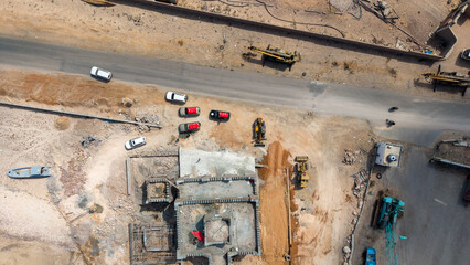 Aerial View of Construction Site with Vehicles and Machinery