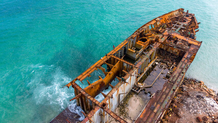 Rusted Shipwreck on Turquoise Shore