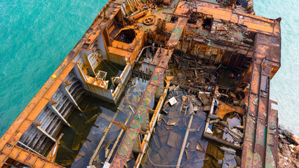 Aerial View of Rusted Shipwreck in Turquoise Waters