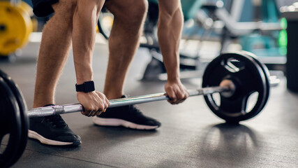 Portrait Of Unrecognizable Male Athlete Working Out With Barbell At Gym, Sporty Man Making Deadlift...