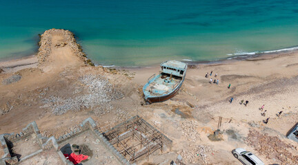 Aerial View of Abandoned Boat on Sandy Beach