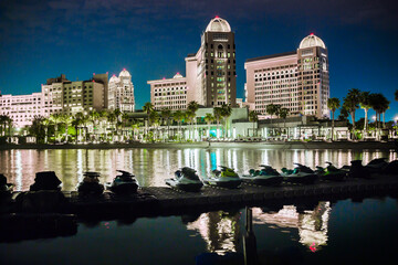 Nigh costal view with cabanas and white sand beach. Doha, Qatar