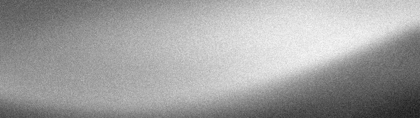 Fototapeta premium Abstract wide grainy background with a monochromatic black, grey, and white gradient, featuring original noise texture and blurred light for modern banners