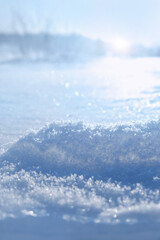 texture of snow, abstract nature sunny background. Beautiful blue-white snowflakes surface close up. winter season. anomaly cold temperature, frozen weather. Christmas, new year holidays vibes.
