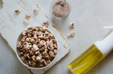 Protein Popcorn in a White Bowl on a Light Background