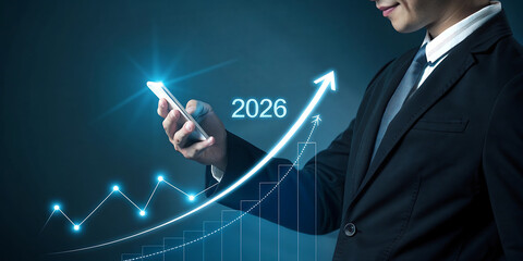 Businessman in dark suit interacts with glowing graph and 2026 projection