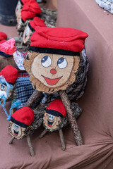 Caga Tio traditional Catalan Christmas logs at a market