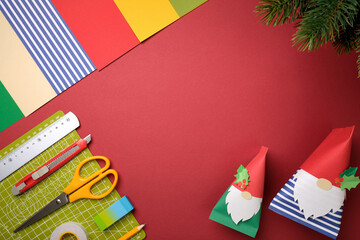 Hobby background with DIY paper gnomes and craft tools. Copyspace