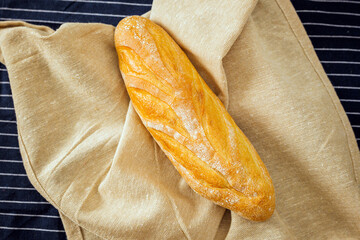 Freshly baked bread on a kitchen cloth
