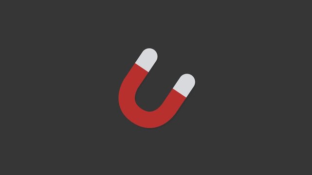 Magnetic Field Concept: A vibrant red and white horseshoe magnet stands prominently against a sleek, gray backdrop, symbolizing the power of attraction.