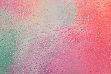 Smoke soft focus water drops through wet glass . Abstract neon pink, violet, beige gradient blur background.