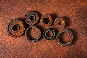 old rusty gears on a brown background