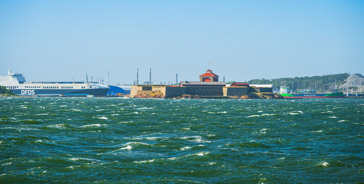 Gothenburg, Sweden - June 29 2025: DFDS freight ferry and industrial coastline scene.