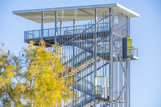 The Lake Atlas Observation Tower, also known as The Lookout Tower, rises 75 feet above Atlas Lake in Bryan, Texas. This modern metal structure features observation decks and three strategic viewpoints