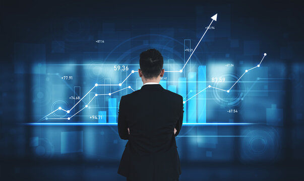 A businessman stands before a digital interface filled with financial graphs, analyzing trends and metrics crucial for informed business decisions and strategies. Scalp - Powered by Adobe