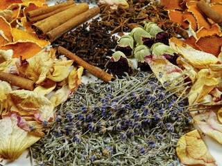 Dried herbs, flowers, spice, orange peels, top view, background. Ingredients for air freshening and relaxation.
 