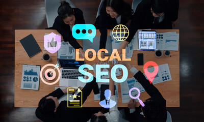 A dynamic team collaborates on local SEO strategies, utilizing charts and devices while incorporating visual communication icons to enhance marketing effectiveness. Gantry