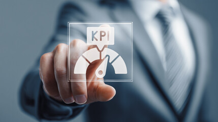 Businessman touching a virtual KPI dashboard icon, symbolizing performance measurement, business analytics, strategic goals, and data-driven decision making in a corporate environment.