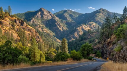 Fototapeta premium Serene Mountain Landscape Under Clear Blue Sky with Lush Greenery and Winding Road Through Hills and Scenic Views of Nature and Trees